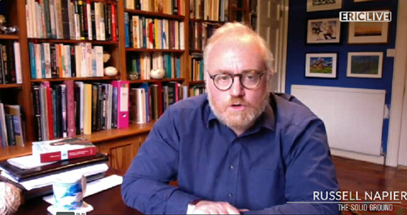 Russell Napier sitting in his library