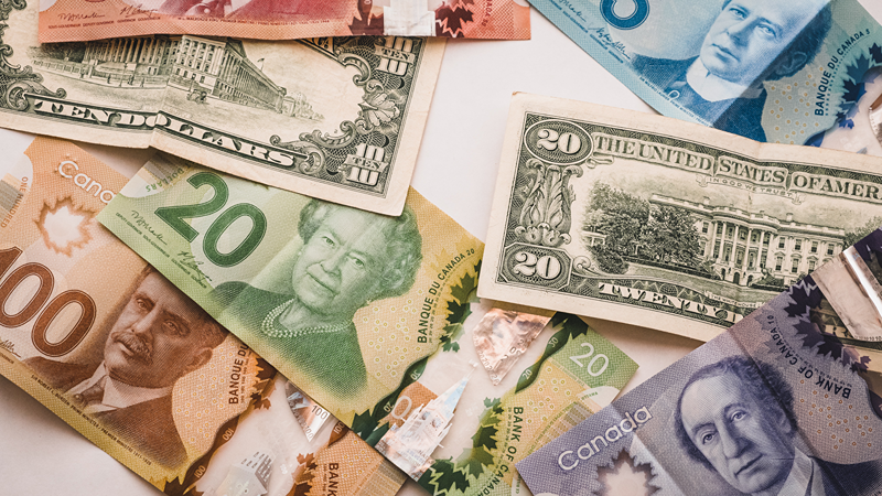 CAD and USD bills laid down
