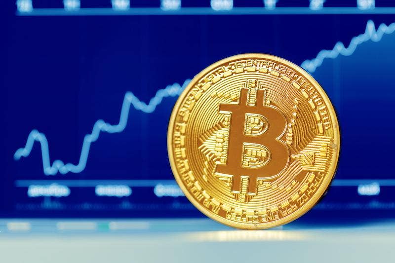 Bitcoin with graphs in background