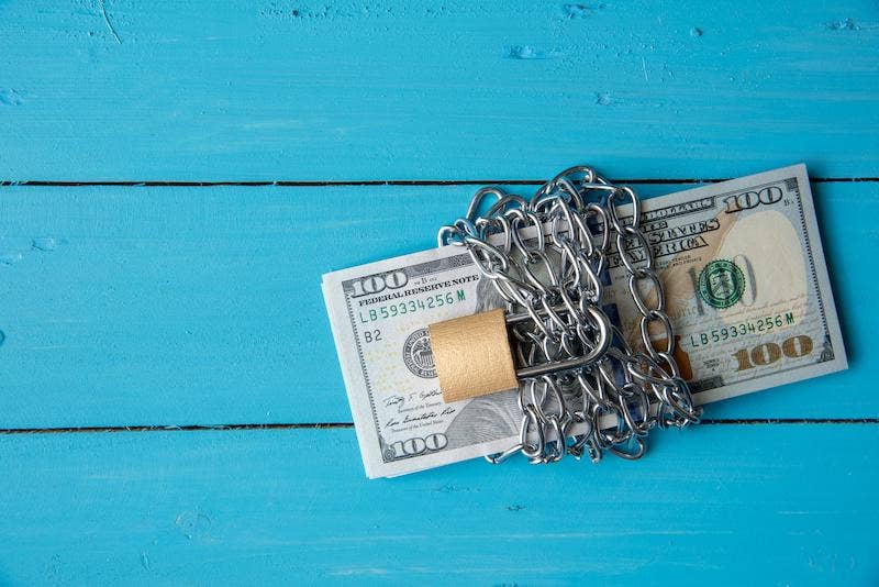US Dollar tied with chains and locked