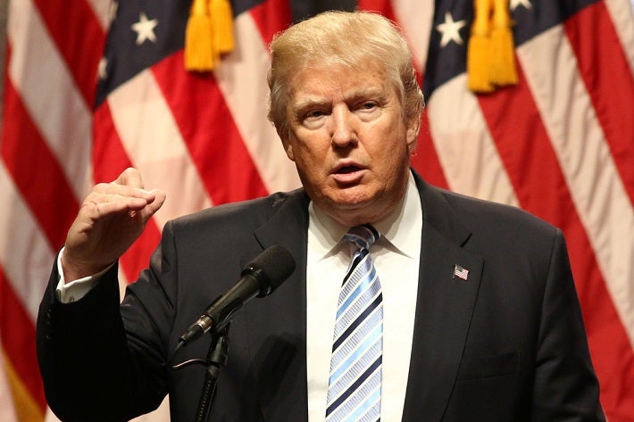 Image of President Trump speaking in from of a podium.
