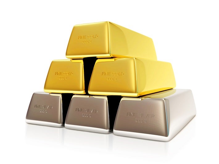 Image of 3 silver bars with 2 gold bars stacked above with 1 gold bar stacked on top