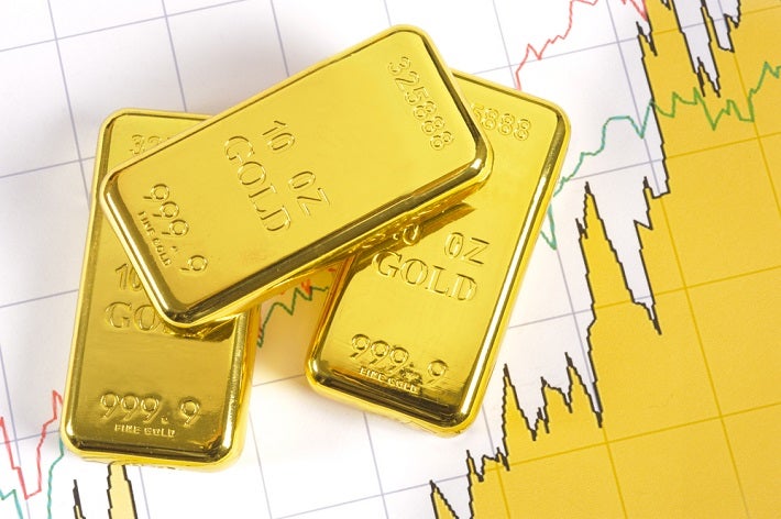 Image of 3 gold bars on a backdrop of a upward trending chart.