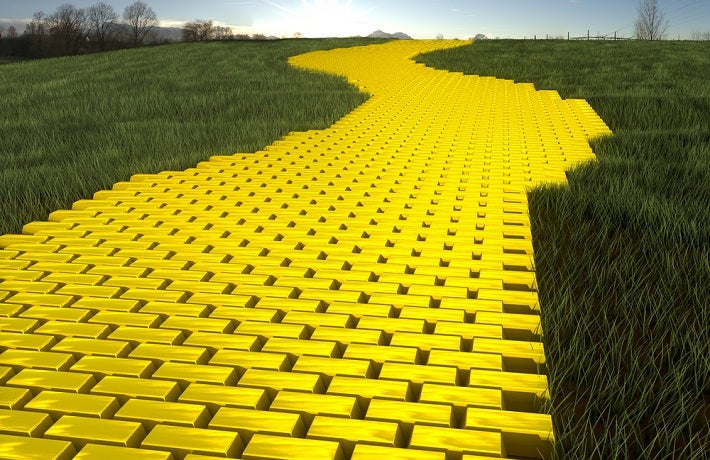 A path of gold bars with grass on both sides