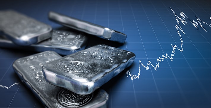 Silver bars placed on the blue chart showing a reading of graph