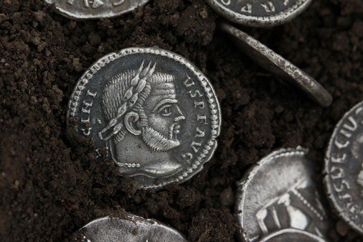 Silver coins lying in something black