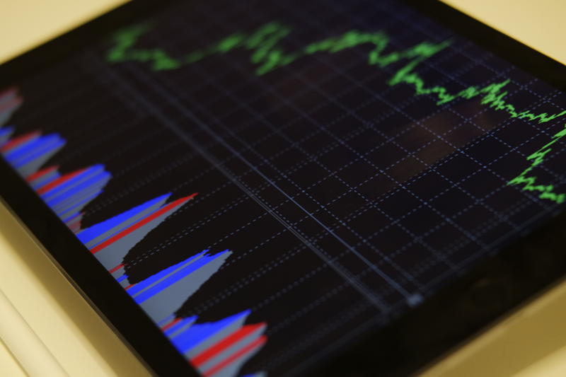 tablet with stocks and pen