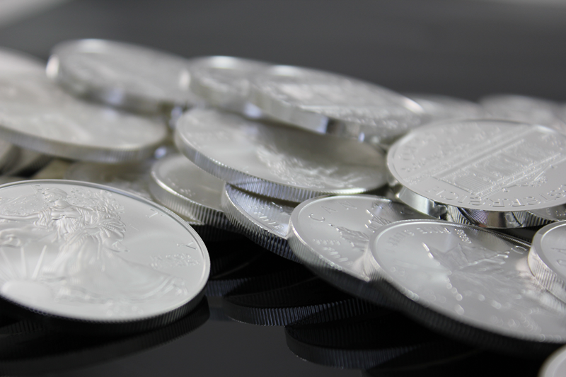 silver coins on table