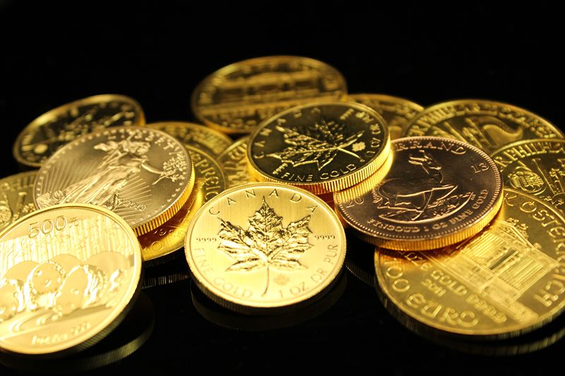 gold coins on black table